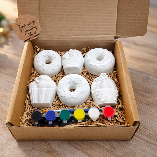Cupcakes and doughnut painting kit use as a paper weight